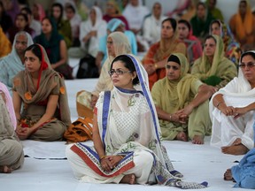 Women attend a remembrance service at Gurdwara Khalsa Parkash for the victims of the Wisconsin Sikh temple shooting, Sunday, August 12, 2012. (DAX MELMER/The Windsor Star)