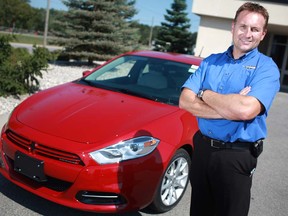 In this file photo, Udo Kiewitz, general manager of Provincial Chrysler, stands next to a 2013 Dodge Dart.  (DAX MELMER/The Windsor Star)