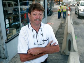 Iggy Power, owner and operator of Power Cycle on Walker Road, is pictured in front of his business where traffic has been rerouted to only four feet from the building, Thursday, August 2, 2012.  (DAX MELMER/The Windsor Star)