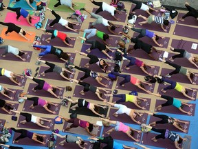 A group of people doing yoga. (File photo)