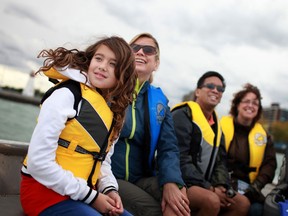 Meghan Briese, 11, left, and her mother, Merilyn, take a boat over to Peche Island along with her father, Dave Briese, (not pictured), for Peche Island Day, Saturday, Sept. 22, 2012.  (DAX MELMER/The Windsor Star)