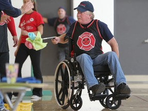 Dave Ethier, of Windsor Fire and Rescue, participates in the 6th annual Canadian Paraplegic Association Ontario, Wheelchair Relay Challenge at Michel-Gratton high school, Saturday, Sept. 29, 2012.  (DAX MELMER/The Windsor Star)