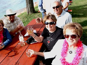 Sue Langlois, left, Pete Harris, Stan Langlois, Mary Fournier and Lynda Pigeon enjoy some wine on the waterfront at the Shores of Erie International Wine Festival on Sunday, Sept. 9, 2012. (REBECCA WRIGHT/ The Windsor Star)