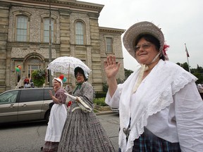 In this file photo, Ashley LLoyd, left, Irene Demarce and Elizabeth Kersey wave to the parade crowd as they stroll past the historic Mackenzie Hall on Sandwich Street. The Olde Sandwich Towne Festival promotes and celebrates the unique history and cultural heritage of the historic neighbourhood. (The Windsor Star - Photo by: Nick Brancaccio).