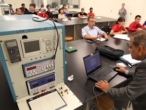 Prof. Esam Abdel-Raheem, right, conducts his class in the ultra-modern Ed Lumley Centre for Engineering Innovation at the University of Windsor on Sept.17, 2012.  The $112-million building opened its doors Monday for labs. (NICK BRANCACCIO/The Windsor Star)