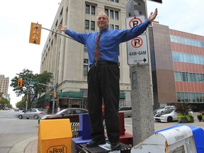 Larry Horwitz, chair of the DWBIA poses on Ouellette Ave. Thursday in downtown Windsor, Ont. Horwitz is excited to announce the proposal to have a Christmas parade on Ouellette Ave.  (DAN JANISSE/The Windsor Star)