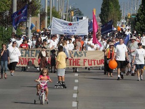 People representing CAW Local 444 participate in Windsor, Ont.'s Labour Day parade on Walker Road, Monday, September 3, 2012.  (DAX MELMER/The Windsor Star)