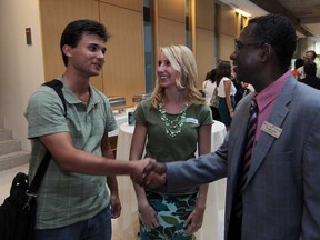 First-year medical students,  Vaso Goobarevic, left,  and Jessica Smith, 22, talk with assistant dean, Dr. Mark Awuku, during a meet & greet event at the Schulich School of Medicine & Dentistry - Windsor Program at the Univeristy of Windsor on Tuesday, September 4, 2012.  Goobarovic, and Smith are local  students who have chosen to stay in Windsor  for their medical studies.   (JASON KRYK/ The Windsor Star)