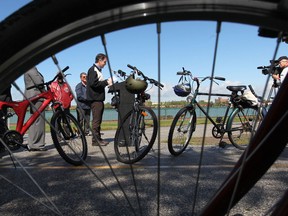 In this file photo, Brian Masse, at podium, MP for Windsor-West, speaks during a press conference along the banks of the Detroit River in Windsor, Ont. on Sept. 14, 2012.   The conference dealt with efforts to make the new border crossing, DRIC, open to cyclists.  (JASON KRYK/ The Windsor Star)