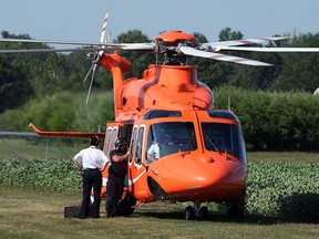 In this file photo, an Ornge helicopter transports a patient to hospital from the Highline Mushroom Plant in Kingsville, Ont., on Monday, July 30, 2012. A person suffered sever injuries at the site and was airlifted to London, Ont.  (The Windsor Star / TYLER BROWNBRIDGE)