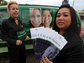 Adrienne Arbour, left, and Heather Ly were busy getting their message that there is help for problem gambling during a stop at Paradise Gaming on Dougall Avenue, Wednesday September 20, 2012.  (NICK BRANCACCIO/The Windsor Star)
