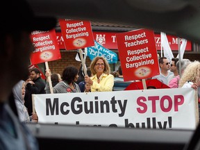 Hundreds of teachers and staffers from six different OSSTF bargaining units and their supporters gather for a Public Education Rally at Teresa Piruzza's office on Dougall Avenue Friday afternoon, June 1, 2012.