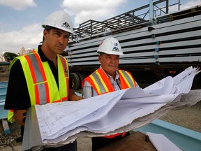 Project manager Don Sadler, right, and Max DeAngelis of DeAngelis Construction check out drawing for Windsor, Ont.'s Family Aquatic Centre  Thursday, September 6, 2012. (NICK BRANCACCIO/The Windsor Star)