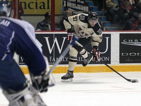 Windsor's Brady Vail, right, beats Sudbury's Joel Vienneau for the opening goal in the first period, as the Windsor Spitfires host the Sudbury Wolves at the WFCU Centre, Sunday, Sept. 30, 201 .   (DAX MELMER/The Windsor Star)