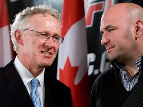 Tom Wright, left,  Director of UFC Canadian Operations speaks at a news conference as Ultimate Fighting Championship President Dana White listens  onMay 25, 2010 at Rogers Centre in Toronto.(National Post files)