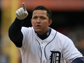 Detroit's Miguel Cabrera points to the crowd after hitting his 42nd homer in the fourth inning against the Minnesota Twins at Comerica Park Saturday. (Dave Reginek/Getty Images)