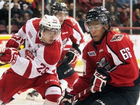 Windsor's Joshua Ho-Sang, right, is checked by the Soo's Sergey Tolchinsky during the Spits' 3-2 victory over the Greyhounds at the Essar Centre in Sault Ste. Marie Saturday. (RACHELE LABRECQUE/Sault Star)