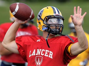 Lancers quarterback Austin Kennedy throws a pass  during practice.  Kennedy threw for three TDs and ran for another as the Windsor Lancers downed the Carleton Ravens 44-14 in Saturday’s OUA football game at Alumni Field to improve to 2-2 on the season. (Windsor Star files)