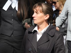 Former Walmart employee Meredith Boucher walks out of Superior Court of Justice during the first day of a civil trial by jury on Sept. 24, 2012.(NICK BRANCACCIO/The Windsor Star)