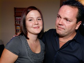 Sporting a shorter high style, Samantha Hann, left, with her father Brian Hann at Windsor and Essex County Cancer Centre Foundation where Samantha donated $2,000 to the Patient Assistance Fund Friday September 28, 2012.   (NICK BRANCACCIO/The Windsor Star)