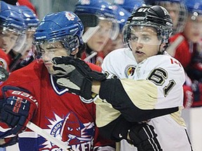 LaSalle's Eric Noel, right, collides with Strathroy's Tyler Coleman at the Vollmer Complex in LaSalle. (JASON KRYK/The Windsor Star)