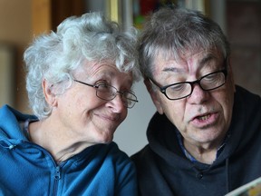 Jerry Cohen reads a book to his wife Anne at their Amherstburg, Ont. home Wednesday, Sept. 19, 2012.  Anne was diagnosed with Alzheimer's disease about six years ago. (DAN JANISSE/The Windsor Star)