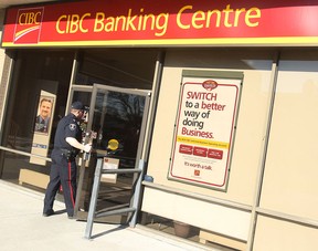 File photo of police investigating a bank robbery at the CIBC on Tecumseh Road in Windsor on March 5, 2010. (TYLER BROWNBRIDGE / The Windsor Star)