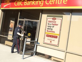 File photo of police investigating a bank robbery at the CIBC on Tecumseh Road in Windsor on March 5, 2010. (TYLER BROWNBRIDGE / The Windsor Star)