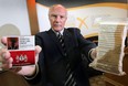 Gary Grant, spokesperson for the National Coalition Against Contraband Tobacco organization displays contraband cigarettes at a news conference. (DAN JANISSE/The Windsor Star)