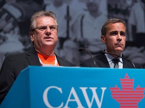 CAW National President Ken Lewenza, left, and Bank of Canada Governor Mark Carney, right, take questions from the audience at the Canadian Automotive Workers' First Constitutional and Collective Bargaining Convention in Toronto on Wednesday, August 22, 2012. THE CANADIAN PRESS/Michelle Siu
