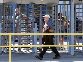 Windsor assembly plant workers make their way in and out during a shift change at the Chrysler plant in Windsor on September 11, 2012. (The Windsor Star /TYLER BROWNBRIDGE)