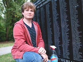 Gabe Voycey, 15, is photographed after cleaning off graffiti of a memorial for fallen soldiers at Memorial Park on Sunday, September 23, 2012. (REBECCA WRIGHT/ The Windsor Star)