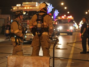 Windsor firefighters work at the scene of an apartment fire at 1075 Wyandotte St. East on Sept. 17, 2012. No injuries were reported and the cause is currently under investigation. (DAX MELMER/The Windsor Star)