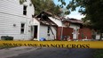 Yellow police tape surrounds the scene of an early morning house fire at 216 Richmond Street in Amerherstburg, Ont., where two people died, Sept. 9, 2012. (DAX MELMER/The Windsor Star)