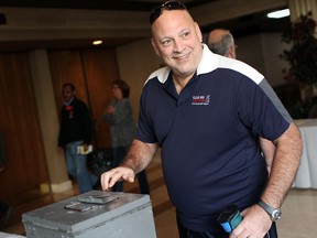 A Ford worker votes on a contract with Ford Motor Co., at the Caboto Club, Sunday, Sept. 23, 2012.  (DAX MELMER/The Windsor Star)