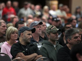 Ford workers listen to Ken Lewenza, President of CAW Canada, as they vote on a contract with Ford Motor Co., at the Caboto Club, Sunday, Sept. 23, 2012.  (DAX MELMER/The Windsor Star)