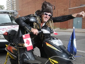 In this file photo, Dan (Hurricane) Halmo poses in Elvis garb last summer in downtown Windsor on Sept. 6, 2011, before setting off on a marathon e-bike ride. (DAN JANISSE / The Windsor Star)