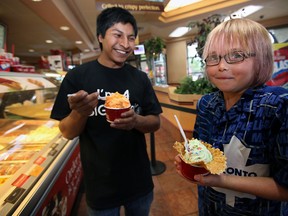 WINDSOR, ONT: Brothers of the Big Brothers Big Sisters of Windsor Essex, Juan Griffith and Joshua, 10, helped kick-off Cold Stone Creamery's fundraising initiative for the child mentoring organization Saturday, September 1, 2012 at the Tim Hortons on the corner of Howard Avenue and Grand Marais Road in Windsor, Ontario. The ice cream parlour chain is donating 15 per cent of all sales to the organization from Saturday to Labour Day. (WINDSOR STAR/ Kristie Pearce)