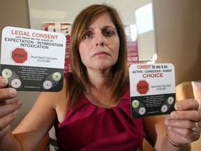 In this file photo, Lydia Fiorini of the Sexual Assault Crisis Centre Essex County displays drink safe coasters which can be used to test drinks for drugs, part of Party Safe program which was launched in 2012. (NICK BRANCACCIO/The Windsor Star)