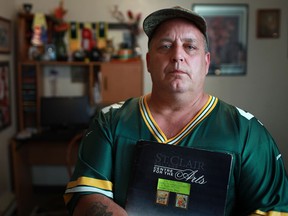 Michael Thornton, 50, a St. Clair College student studying Tourism and Travel, is pictured in his home in West Windsor, Monday, Sept. 17,  2012.  Thornton has not received his OSAP funding and is struggling to pay bills, rent, or buy school supplies.  (DAX MELMER/The Windsor Star)