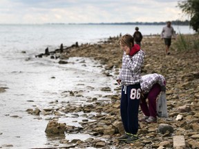 In this file photo, twin sisters, Meighan Pope, left, and Gabby Pope, 11, explore the eastern shore of Peche Island during Peche Island Day, Saturday, Sept. 22, 2012.  (DAX MELMER/The Windsor Star)