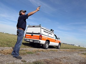 Phil Mailloux fires a noise maker in the air at the Windsor Airport in Windsor on Friday, September 21, 2012. Mailoux is part of the team that keeps the airport free of potentially deadly pests.               (TYLER BROWNBRIDGE / The Windsor Star)