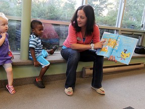 Librarian Julie Catenacci reads to Taejaun Cain and Alina Plante (left) at the Remington Park library branch in Windsor on Tuesday, September 11, 2012. (TYLER BROWNBRIDGE/The Windsor Star)