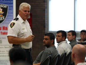 Insp. Tom Crowley of the Windsor Police Service talks to attendees of a recruitment information session, held at the Rose City Islamic Centre on Sept. 6, 2012. (Tyler Brownbridge / The Windsor Star)