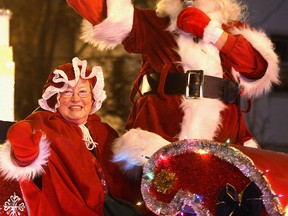 Mrs. Claus and Santa wave to the large crowd that attended the 2010 annual Christmas parade. (Windsor Star files)