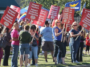 Local Teachers and other union supporters hold a demonstration Friday, Sept. 14, 2012, at the constituency office of MPP Dwight Duncan in Windsor. (DAN JANISSE/The Windsor Star)