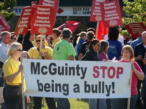 Local Teachers and other union supporters hold a demonstration Friday, Sept. 14, 2012, at the constituency office of MPP Dwight Duncan in Windsor. (DAN JANISSE/The Windsor Star)