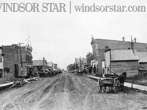 Tilbury, Ont.1887-Main St. also known as Queen St. The street forms the Essex Kent County line with Essex on the left or west and Kent on the right or east side of the photo.
