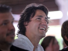 MP Justin Trudeau has a laugh while listening to MPP Dwight Duncan speak while at the Windsor-Essex Liberal BBQ at the Ciociaro Club, Saturday, Sept. 8, 2012. (DAX MELMER/The Windsor Star)