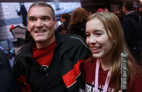 Rick Cipolla, left, and his daughter, Catherine Cipolla, 14, from Ancaster, attend the Hocktoberfest Girls Hockey Tournament at the WFCU Centre, Saturday, Oct. 20, 2012. (DAX MELMER/The Windsor Star)